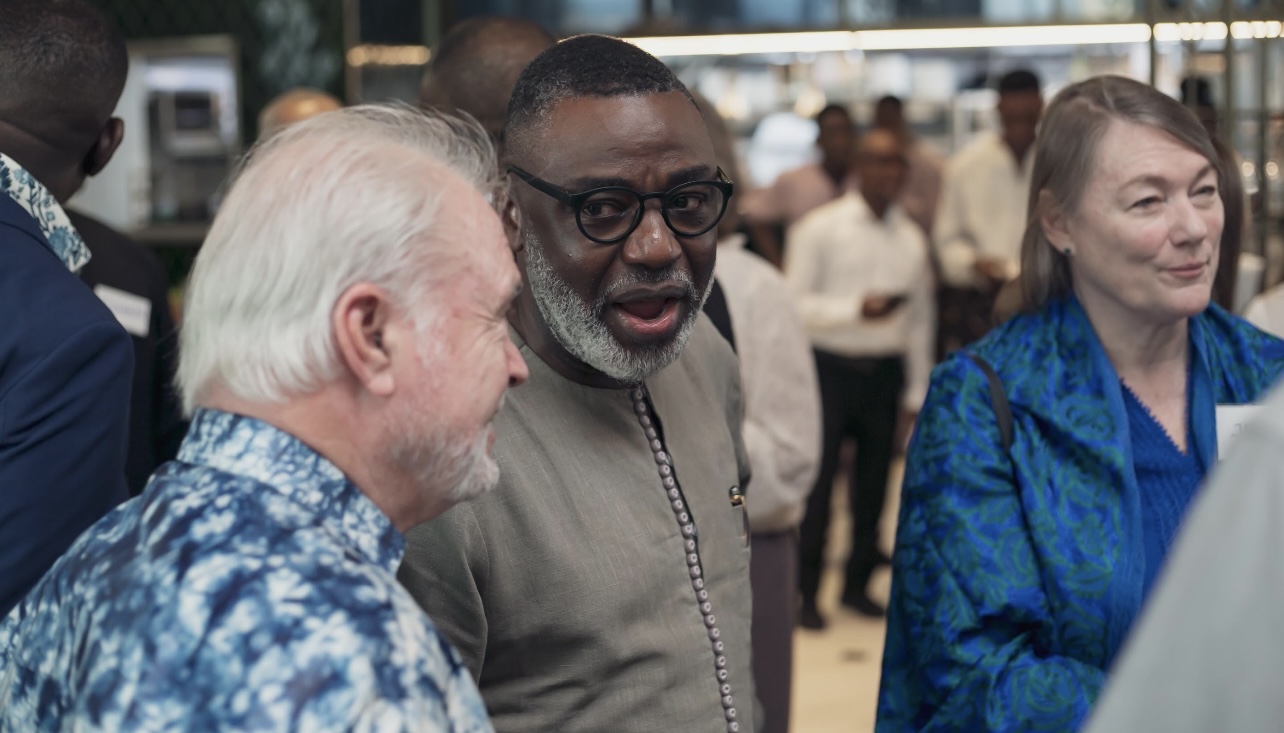 Tunji Idowu in conversation at a reception
